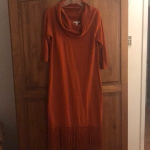 Burnt orange cowl neck sweater dress with fringe